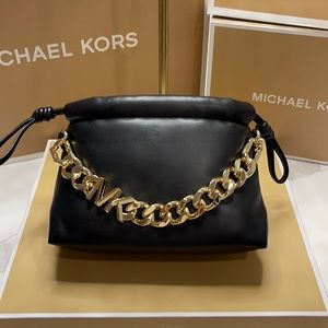 Michael Kors Drawstring purse in black, gold hdw, vegan faux leather